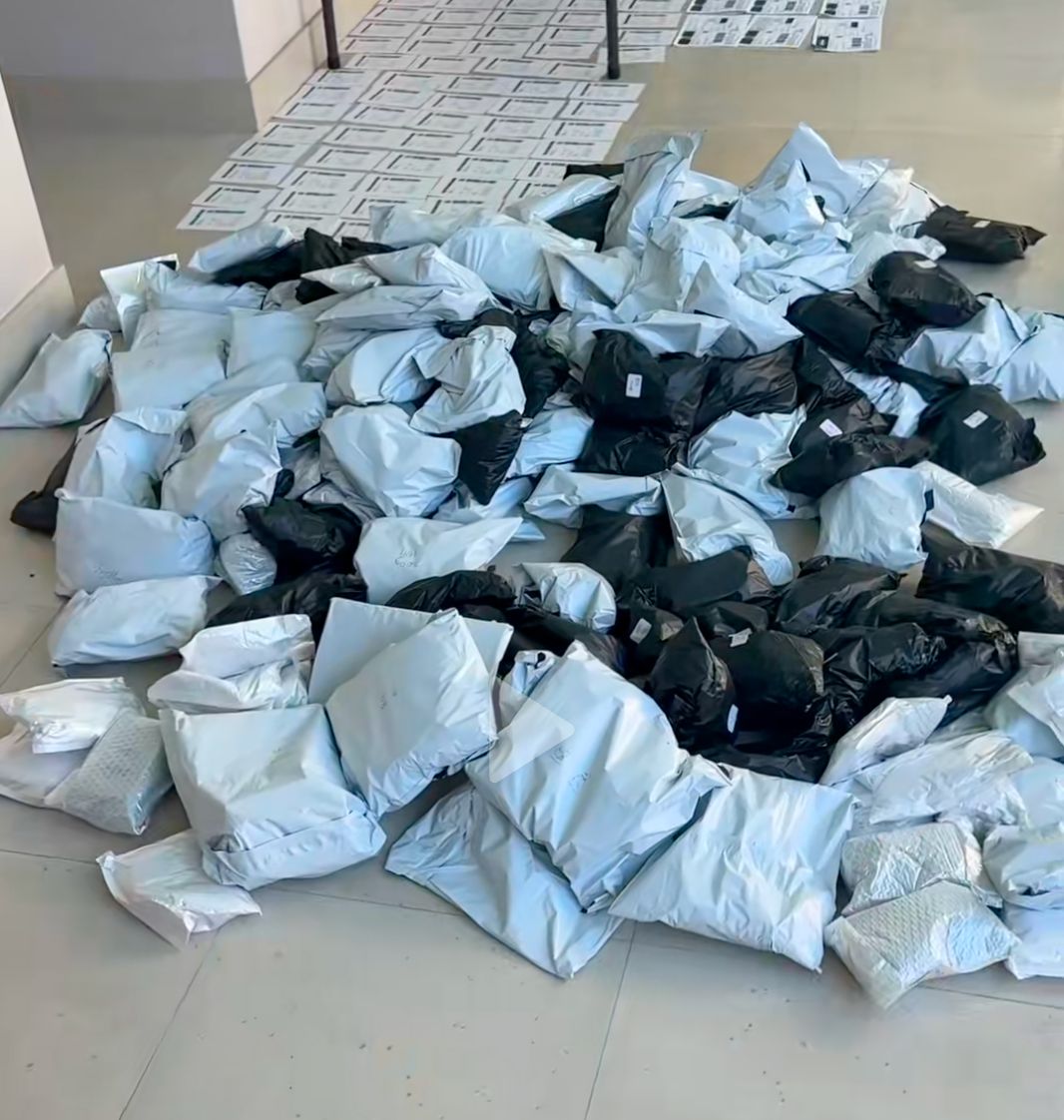 A floor covered in packed PlugNPlay order satchels ready to ship